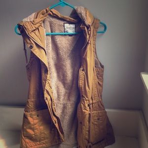 Snobbish brand mustard colored zip-up vest.